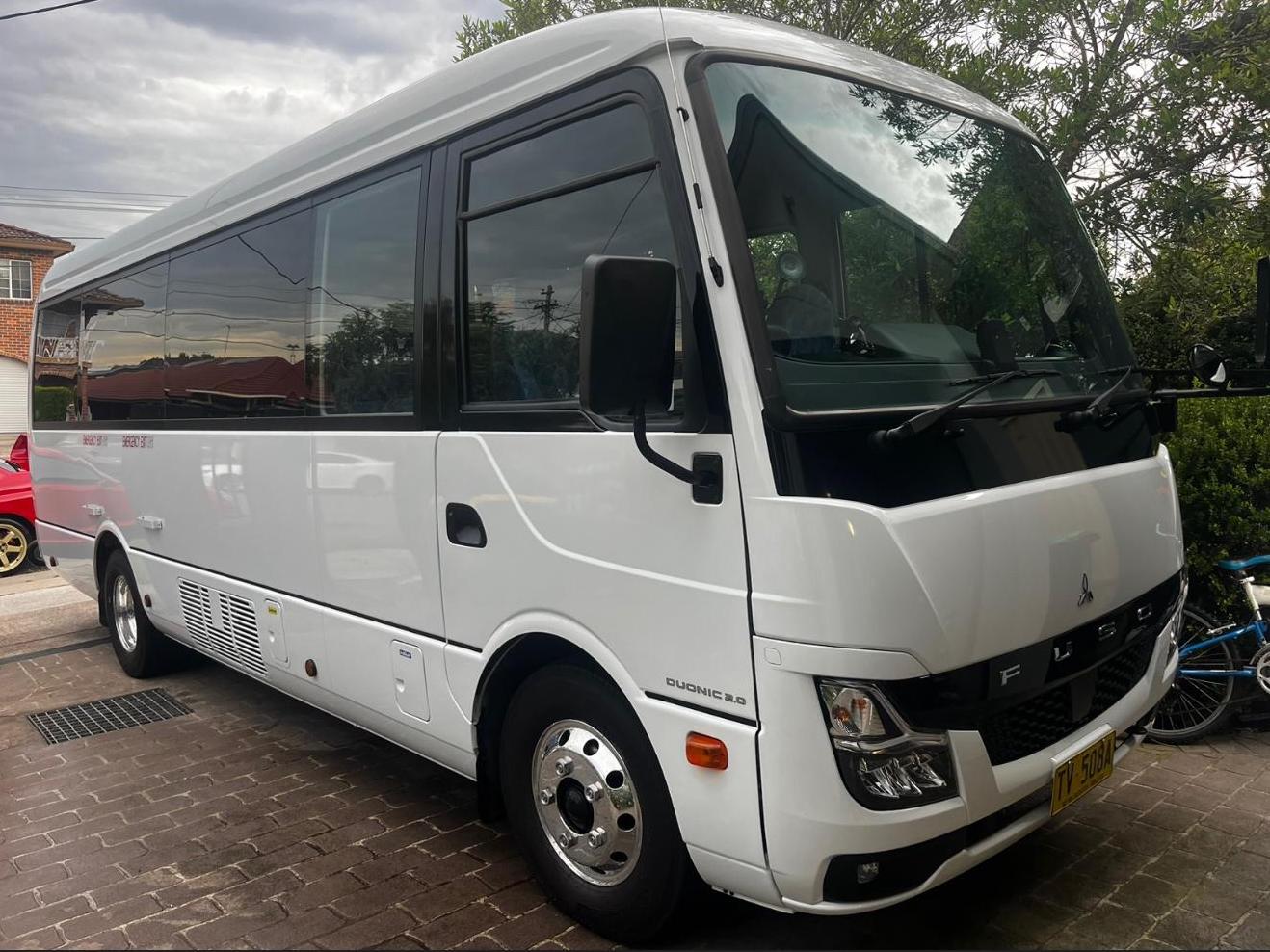 white 21 to 24 seater minibus